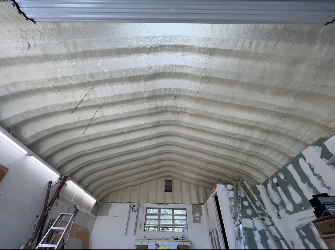 Spray polyurethane foam applied to the underside of a metal roof deck in Salida